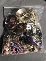 Big gallon sized bag of costume jewelry - a little