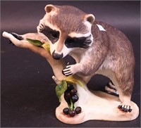 A Cybis figurine of Raffles the Raccoon