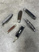 Assortment of multi tools and folding knives,