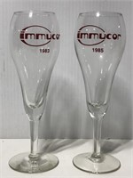 Two 1980’s Immucor advertising stemmed glasses