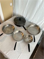5 Frying Pans And 1 Lid