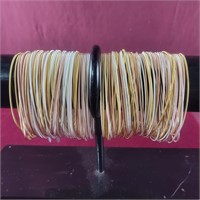 Large group of stretchy metallic bracelets by E&O