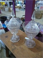 A pair of crystal compotes with lids, one lid is