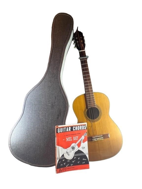 An Acoustic Guitar w/ Case & Stand. Has Broken