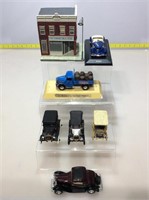 Assorted Die cast cars and corner store figure.