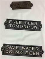 3 small cast signs