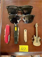 Piranha sunglasses, pocket knives belt buckle etc