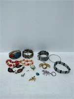 lot of assorted bracelets and other items