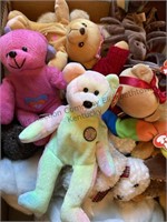 Box of beanie babies and more stuffed animals