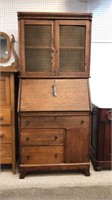 Antique oak drop front secretary desk with a