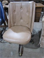 Tan Vinyl Upholstered Swivel Roller Dining Chair