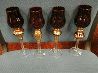 Set of 4 ruby colored glass candlestick holders