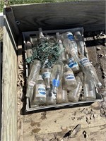 plastic crate with pop bottles