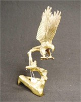 Brass figure of alighting eagle on branch