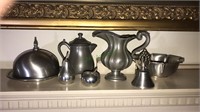 Seven pieces of pewter including salt and pepper