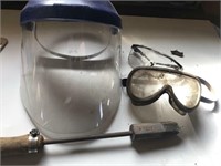 Facemask, safety goggles, welding torch