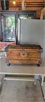 VINTAGE WOODEN TRUNK ON ROLLERS