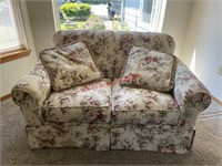 Comfy floral love seat couch (entry room)