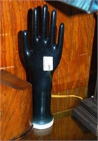 black porcelain gloved hand