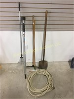 Misc long handle tools & a garden hose