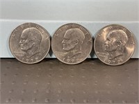 Three 1972D Ike dollars