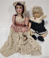 (AN) Lot of 2 dolls the larger has an arm and