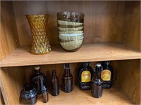 Brown bottles, bowls and vase