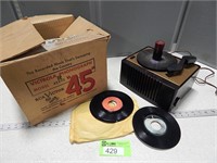 Vintage RCA Victor phonograph with some 45's in or