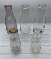 5 assorted milk bottles