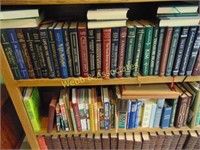 Large assortment of books on bookshelf including