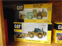 Two Caterpillar wheel loader toys, new in box