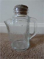 E2) Glass pitcher with cork?