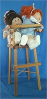 2 Cabbage Patch dolls and highchair