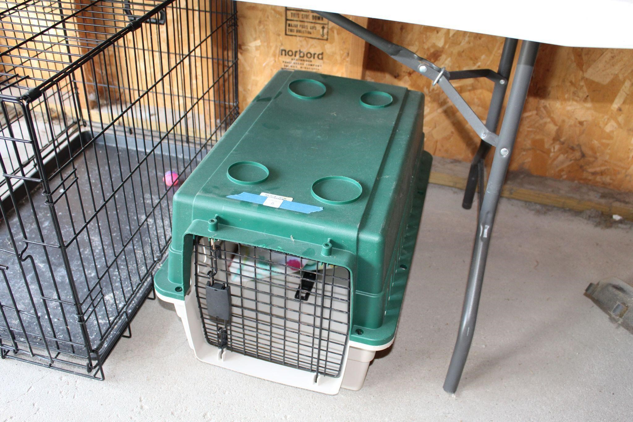 Small green dog crate