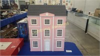 LARGE PINK AND WHITE DOLL HOUSE