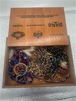 wooden box full of beaded jewelry