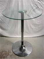 Round glass top hydraulic table.