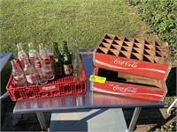 TWO WOODEN COKE CRATES WITH ASSORTED COKE AND TOMS