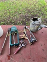Assorted sprinkers and gardening tools