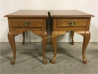 2 oak end tables with a small drawer in each