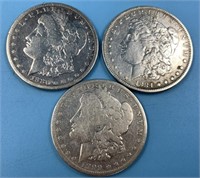 3 Morgan silver dollars: 1884, 1899 O, 1880 S