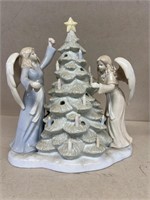 Porcelain angels and Christmas tree