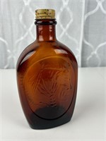 Amber Log Cabin Indian Head bottle