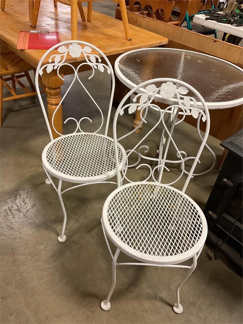Glass top metal table table and two chairs