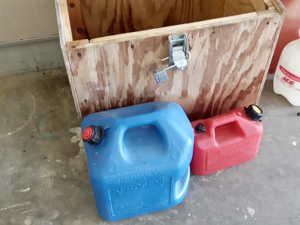 wood box with gas cans & oil