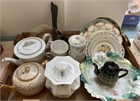 Large flat with teapots, cabinet plates, pink