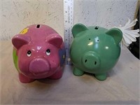 2 ceramic piggy banks with plugs
