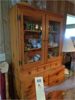 Two piece knotty pine glass door wall cabinet
