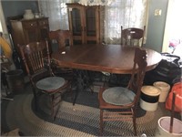 Dining room table w/ 4 chairs and 2 cast iron