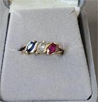Red white and blue ring marked 14k